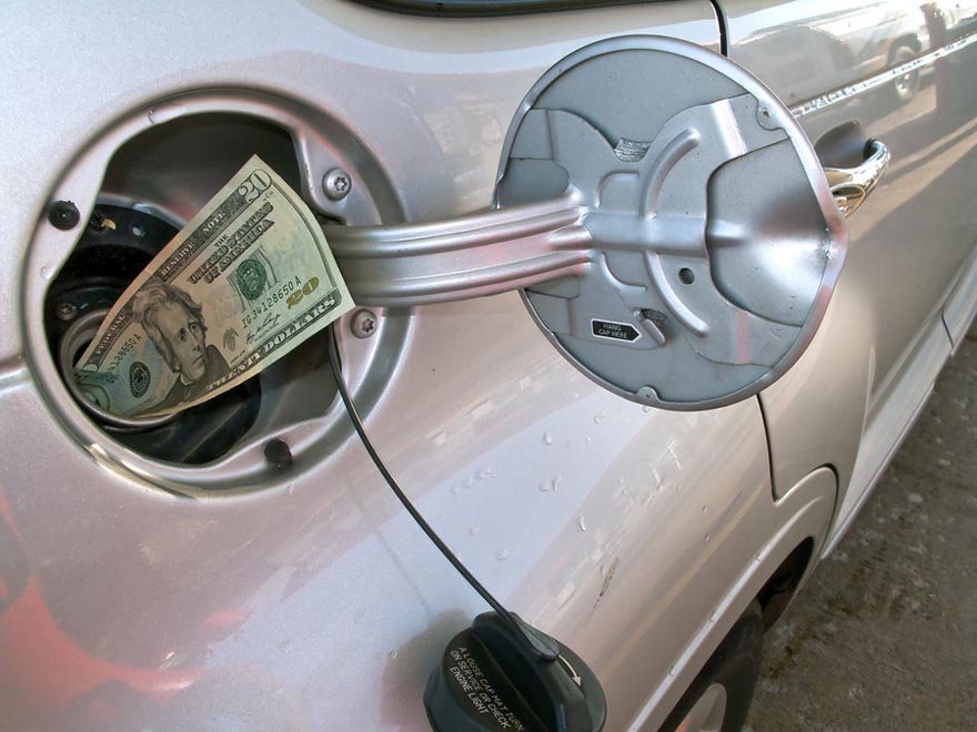 Money-sticking-out-of-automobile-fuel-tank